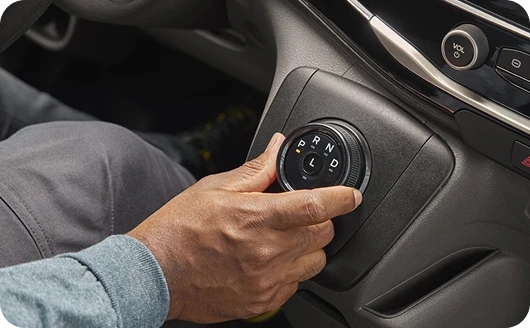 Rotary gear shifter for an uncluttered interior